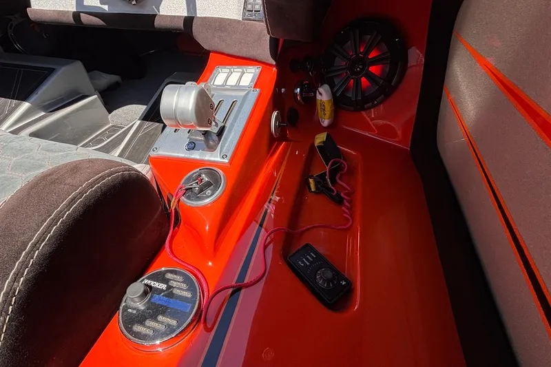 Slide: The Image of Interior of 2020 Eliminator 36 Daytona Coupe with vibrant orange accents and audio controls. - 20