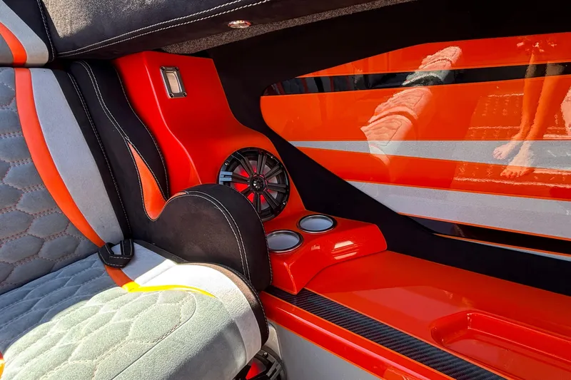 Slide: The Image of Interior of 2020 Eliminator 36 Daytona Coupe with vibrant orange and gray accents. - 22