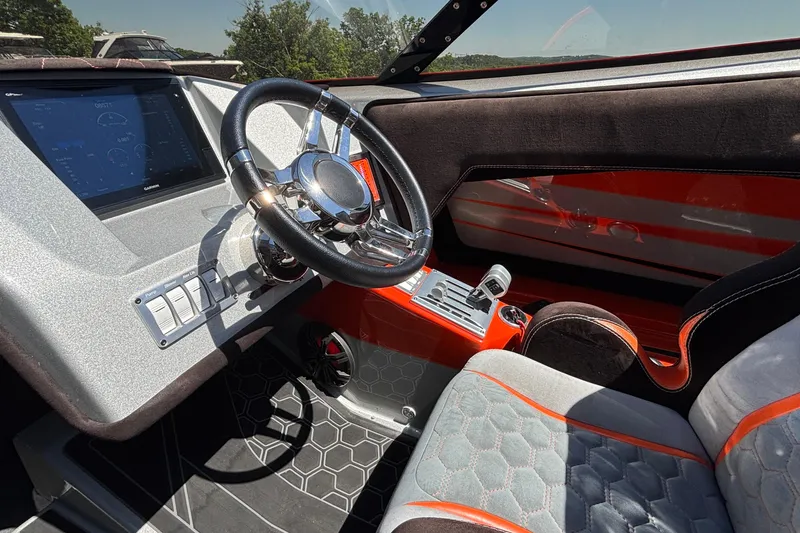 Slide: The Image of Interior of a 2020 Eliminator 36 Daytona Coupe with modern dashboard and steering wheel. - 23