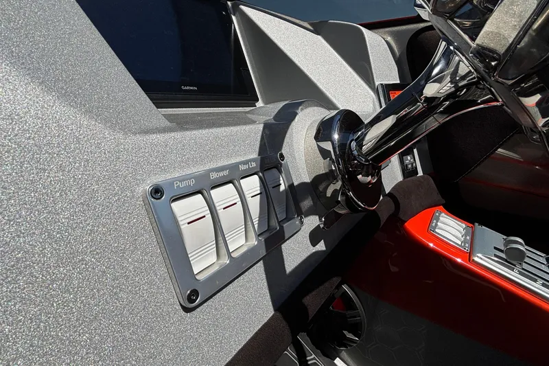 Slide: The Image of 2020 Eliminator 36 Daytona Coupe dashboard with switches and steering wheel detail. - 24