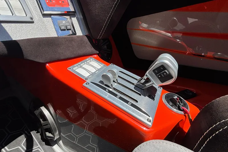 Slide: The Image of Interior of a 2020 Eliminator 36 Daytona Coupe with sleek red and silver controls. - 25