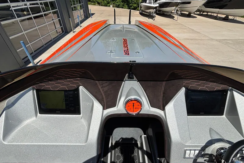 Slide: The Image of 2020 Eliminator 36 Daytona Coupe dashboard with navigation screens and sleek design. - 27
