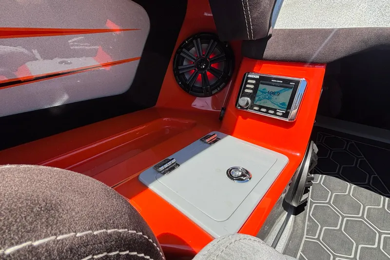 Slide: The Image of 2020 Eliminator 36 Daytona Coupe interior with audio system and sleek red design. - 32