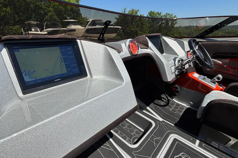 Slide: The Image of 2020 Eliminator 36 Daytona Coupe cockpit with GPS display and modern steering wheel. - 33