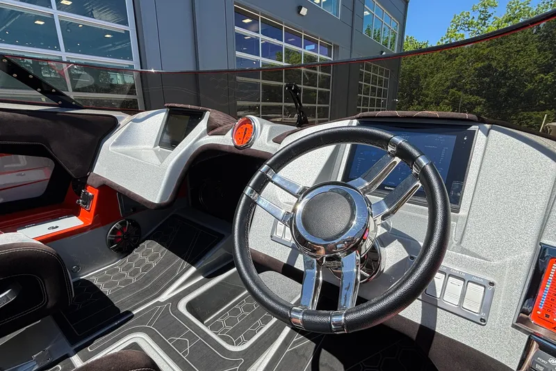 Slide: The Image of Interior of a 2020 Eliminator 36 Daytona Coupe, featuring a sleek steering wheel and modern dashboard. - 34