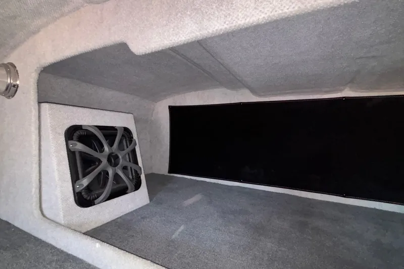 Slide: The Image of Interior of 2020 Eliminator 36 Daytona Coupe with subwoofer and carpeted finish. - 44