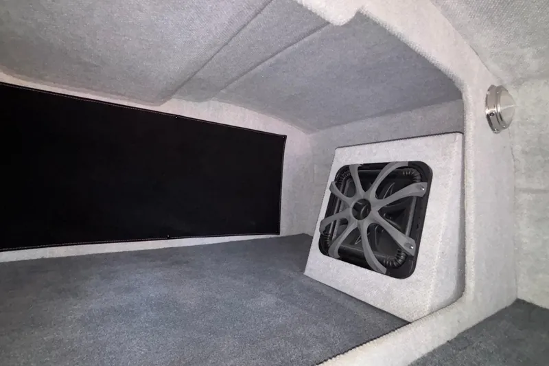 Slide: The Image of Interior of 2020 Eliminator 36 Daytona Coupe with subwoofer and carpeted finish. - 45