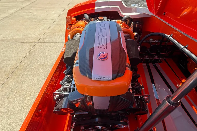 Slide: The Image of 2020 Eliminator 36 Daytona Coupe engine, vibrant orange and black design, high-performance setup. - 49