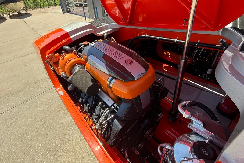 Slide: The Image of 2020 Eliminator 36 Daytona Coupe engine compartment with vibrant orange detailing. - 50