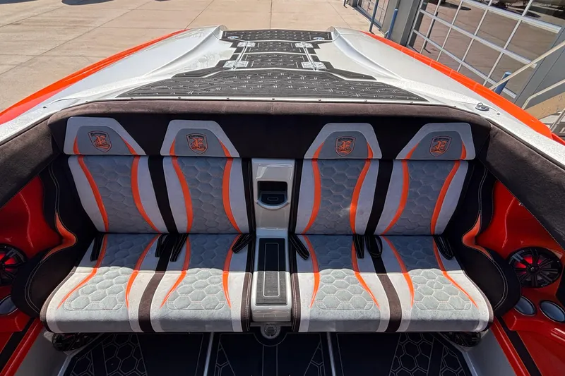 Slide: The Image of Interior of 2020 Eliminator 36 Daytona Coupe with stylish orange and gray seating. - 54