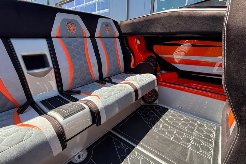 Slide: The Image of 2020 Eliminator 36 Daytona Coupe interior with stylish orange and gray seating design. - 56