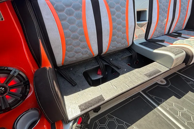 Slide: The Image of 2020 Eliminator 36 Daytona Coupe interior with orange and gray seating, featuring hexagonal patterns. - 57