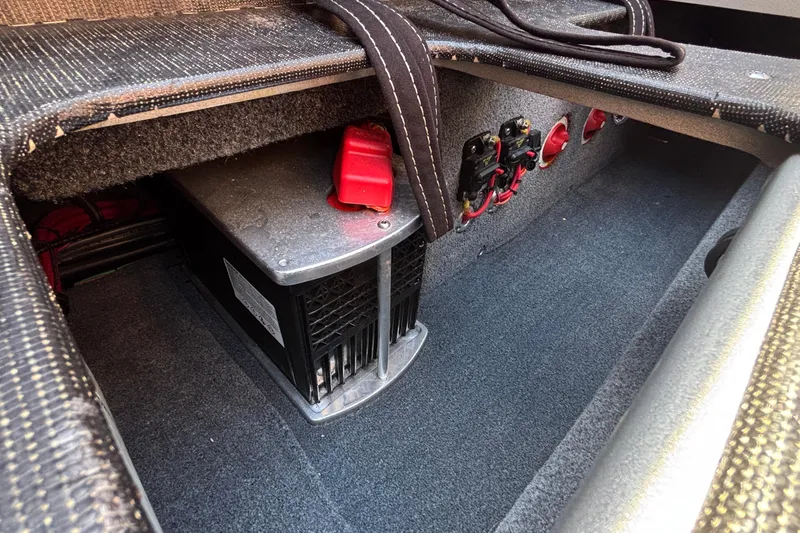 Slide: The Image of 2020 Eliminator 36 Daytona Coupe battery compartment with wiring and red connectors. - 58