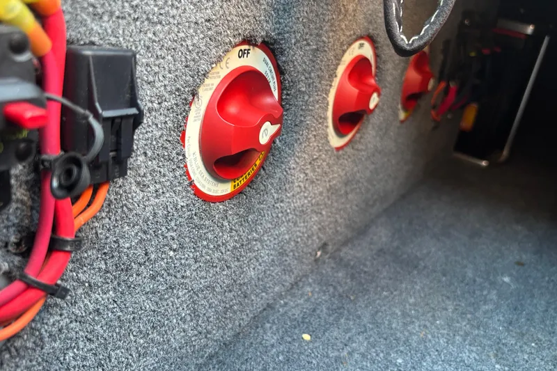 Slide: The Image of Red battery switches in a 2020 Eliminator 36 Daytona Coupe interior. - 59