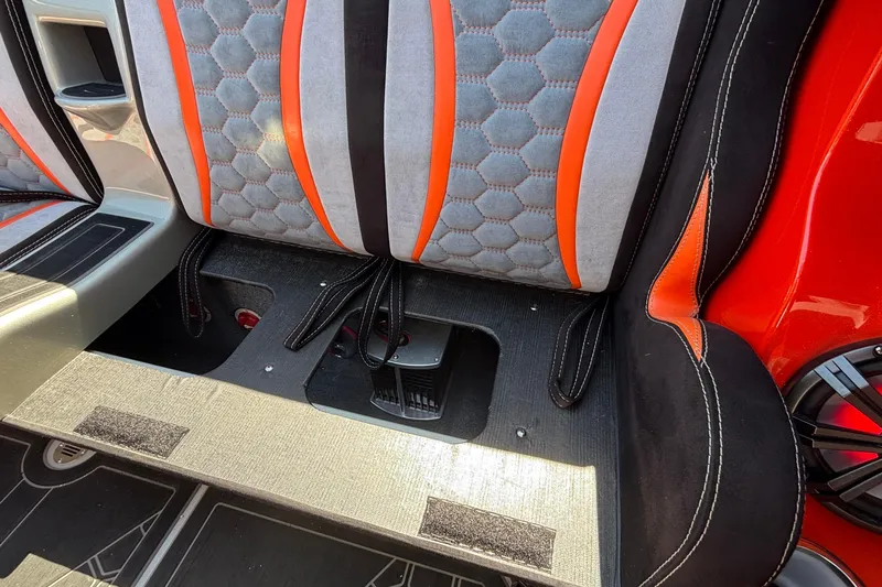 Slide: The Image of 2020 Eliminator 36 Daytona Coupe interior with orange and gray hexagonal-patterned seats. - 60