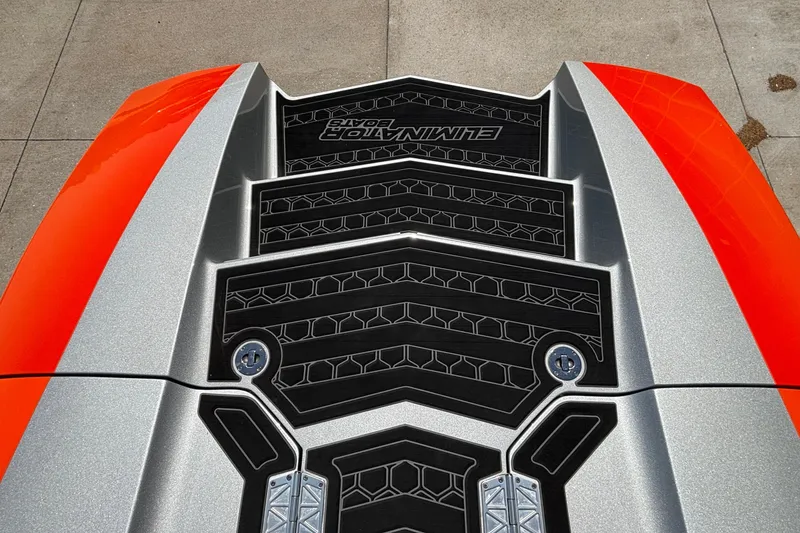 Slide: The Image of 2020 Eliminator 36 Daytona Coupe with sleek orange and silver detailing on the deck. - 63