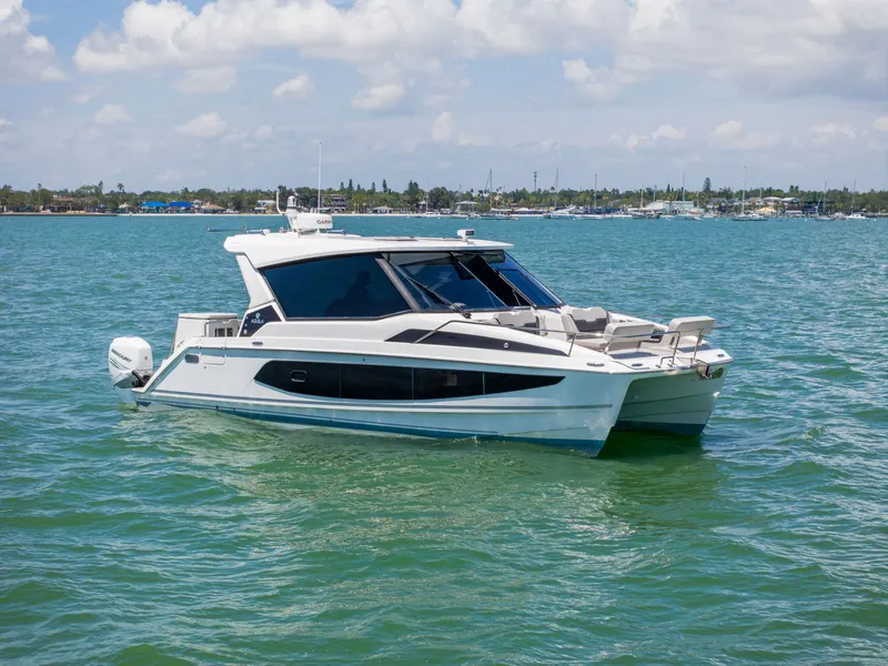 Slide: The Image of Aquila 36 Sport 2023 on calm waters, modern catamaran. - 0