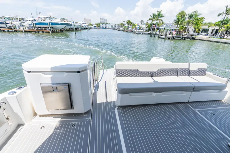 Slide: The Image of Aquila 36 Sport 2023 with luxurious deck and seating area. - 12