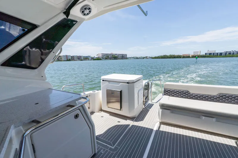 Slide: The Image of Aquila 36 Sport 2023 yacht with modern deck design on calm waters. - 14