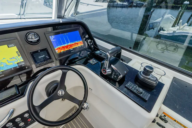 Slide: The Image of Aquila 36 Sport 2023 cockpit with advanced navigation technology. - 27