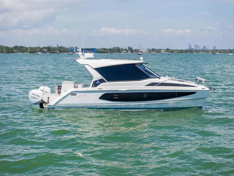 Slide: The Image of 2023 Aquila 36 Sport on calm water, side view. - 3
