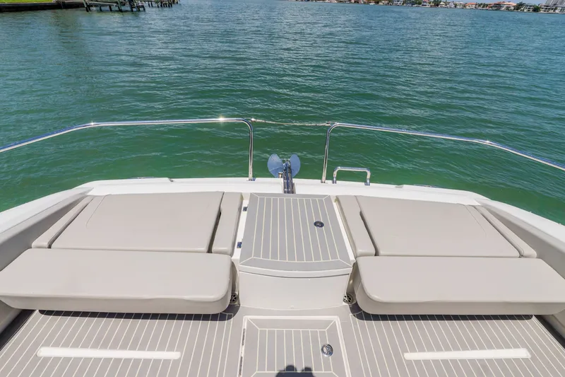 Slide: The Image of Aquila 36 Sport 2023 boat rear with seating area on water. - 36