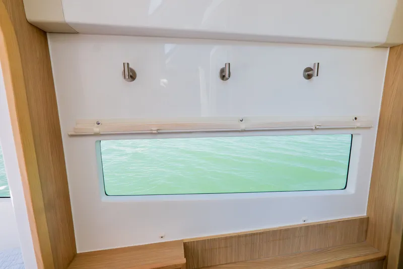 Slide: The Image of Interior view of 2023 Aquila 36 Sport with window and hooks. - 39
