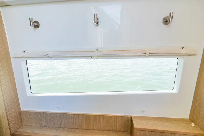 Slide: The Image of Interior view of 2023 Aquila 36 Sport with window overlooking water. - 43