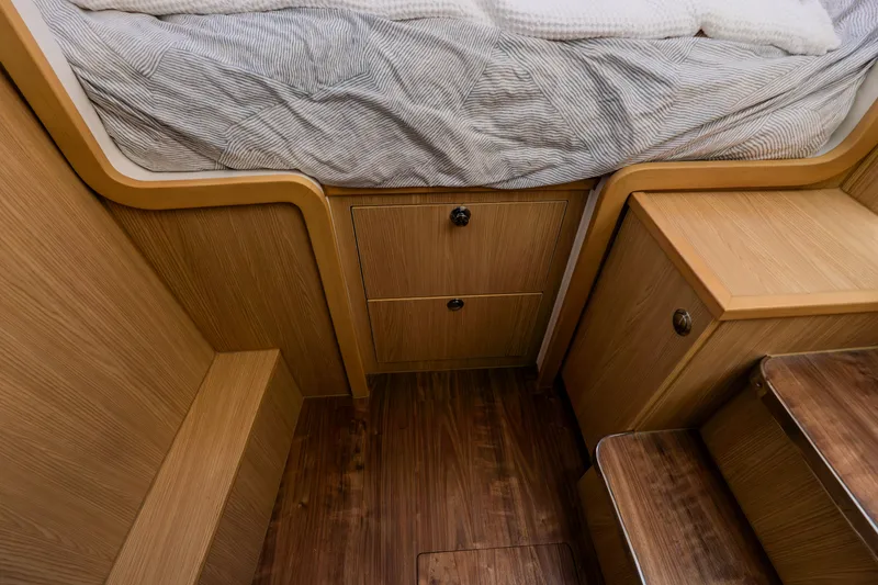 Slide: The Image of Interior of 2023 Aquila 36 Sport with wooden furniture and bed. - 45