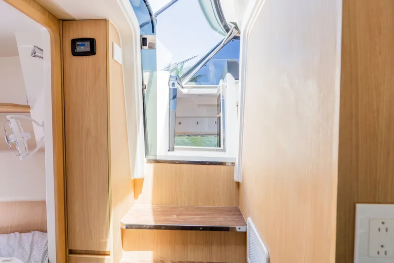 Slide: The Image of Interior of 2023 Aquila 36 Sport with wooden finish. - 46