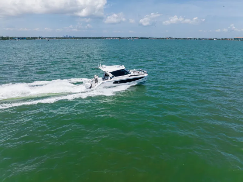 Slide: The Image of Aquila 36 Sport 2023 cruising on open sea under clear skies. - 7
