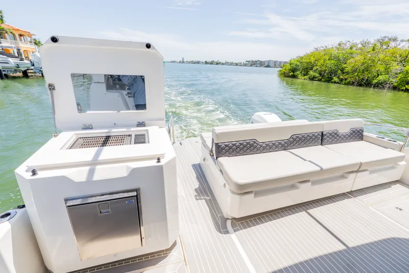 Slide: The Image of Aquila 36 Sport 2023 with seating and grill on the water. - 8