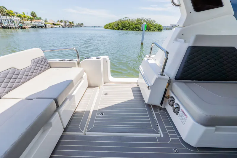 Slide: The Image of Interior of 2023 Aquila 36 Sport with luxurious seating and water view. - 9