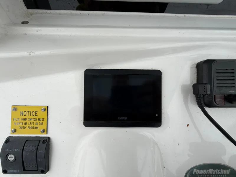 Slide: The Image of Yamaha display and bilge pump switch on NorthCoast 230 CC boat. - 14
