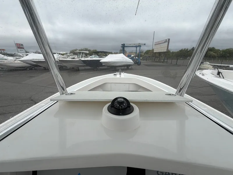 Slide: The Image of 2022 NorthCoast 230 CC boat on a parking lot. - 15