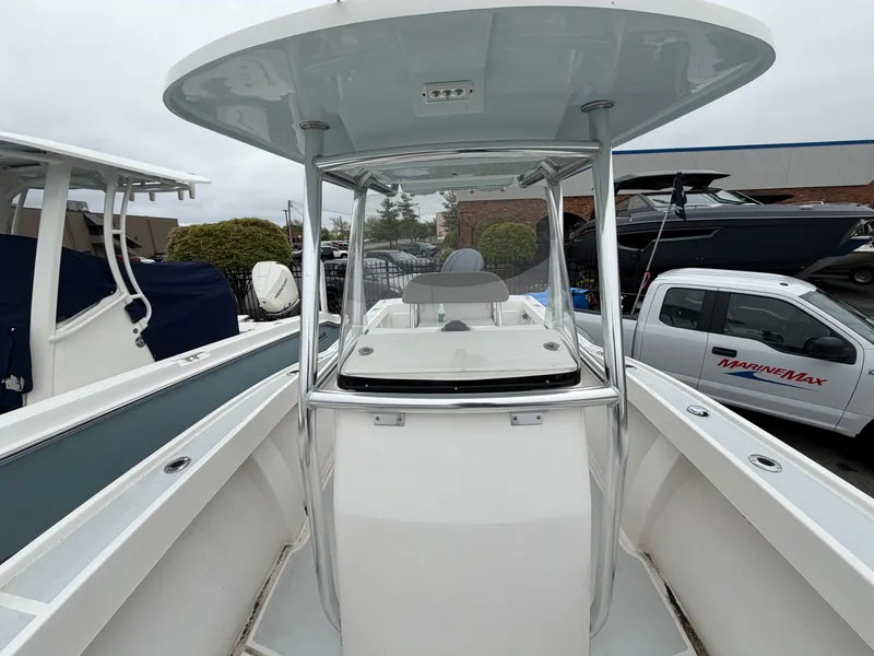 Slide: The Image of 2022 NorthCoast 230 CC boat with T-top and helm station. - 18