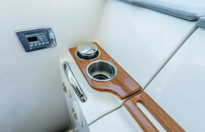 Slide: The Image of Interior of 2020 Tiara Yachts 34lx with wood accents and controls. - 41