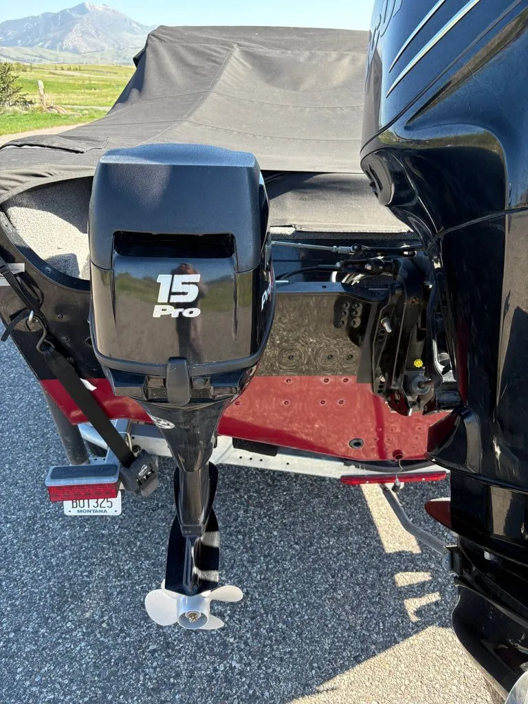 Slide: The Image of Outboard motor of a 2017 Lund 1875 Crossover XS boat. - 12