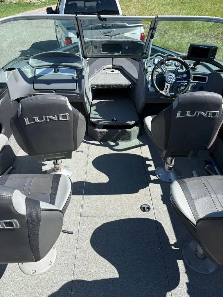 Slide: The Image of Interior of a 2017 Lund 1875 Crossover XS boat with four seats. - 3