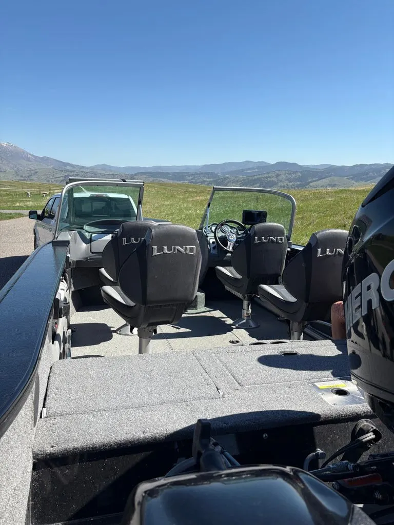 Slide: The Image of 2017 Lund 1875 Crossover XS boat on trailer, scenic background. - 5