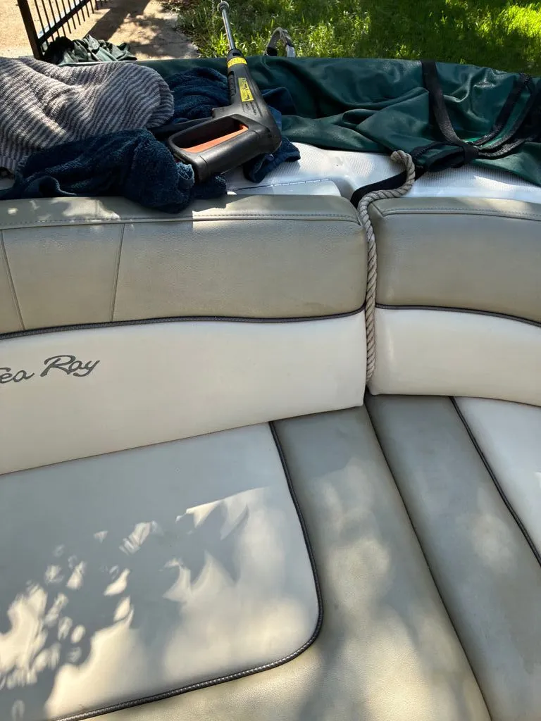 Slide: The Image of Interior of a 2005 Sea Ray 200 Sundeck boat with seat cushions. - 6