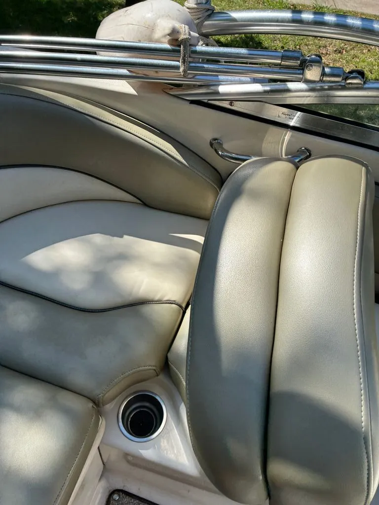 Slide: The Image of Interior of a 2005 Sea Ray 200 Sundeck boat with cushioned seats. - 7