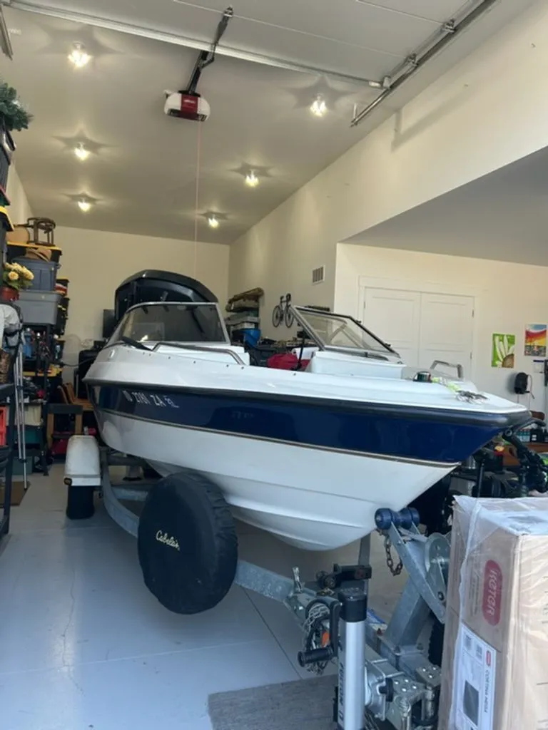 Slide: The Image of 2003 Bayliner 195 Bowrider boat in garage on trailer. - 2