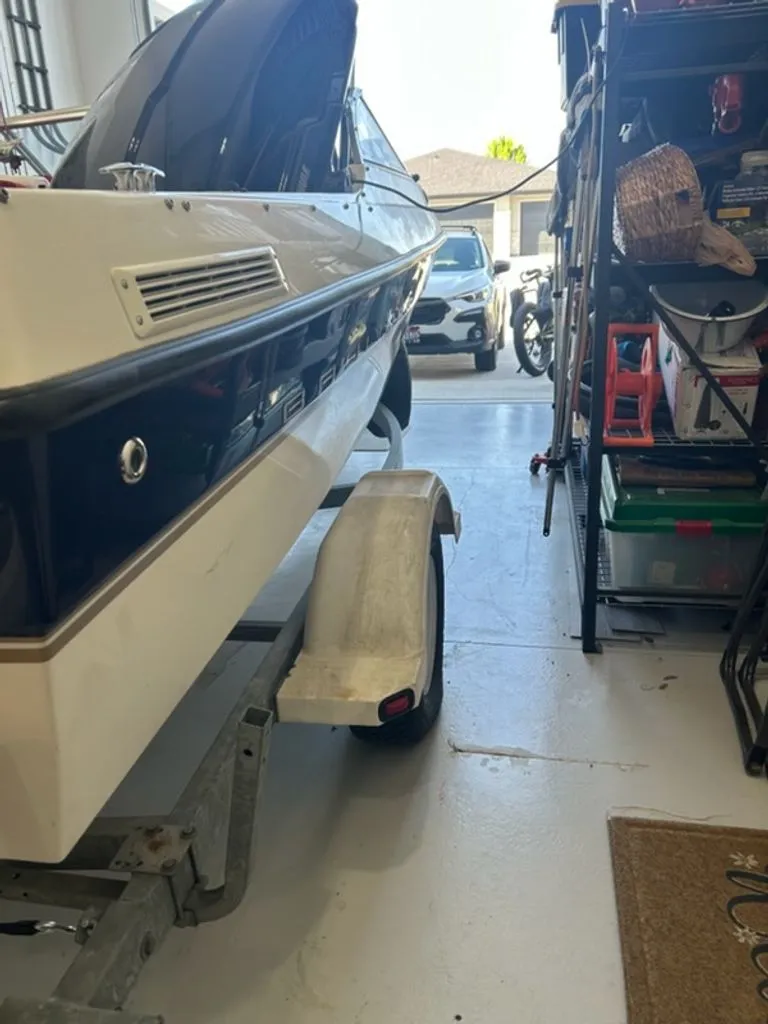 Slide: The Image of 2003 Bayliner 195 Bowrider on trailer in garage. - 8