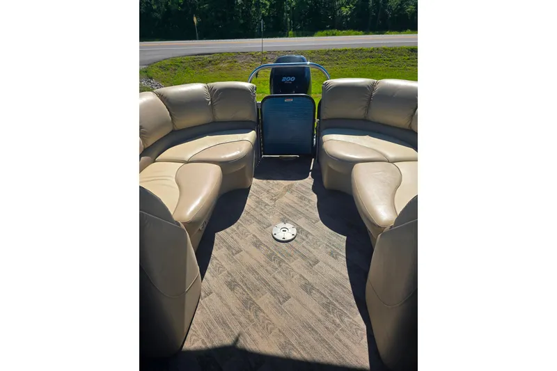 Slide: The Image of Luxurious seating on 2018 Manitou 23 Encore SL pontoon boat, showcasing spacious interior design. - 11