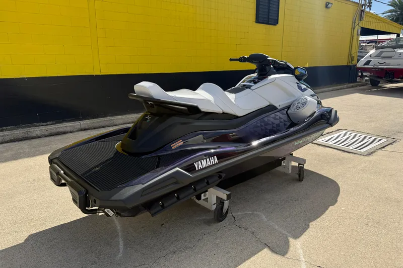 Slide: The Image of 2026 Yamaha WaveRunner VX Cruiser HO parked near a yellow building. - 10