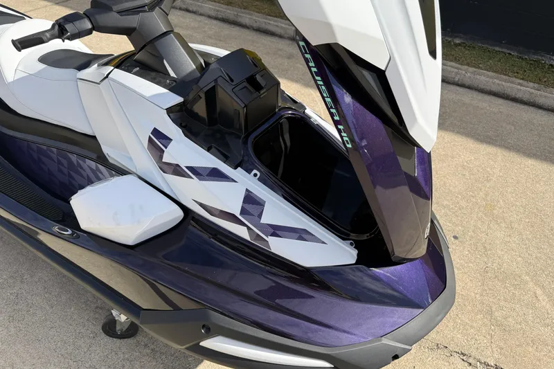 Slide: The Image of 2026 Yamaha WaveRunner VX Cruiser HO with open storage compartment, showcasing sleek design. - 13