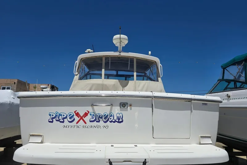 Slide: The Image of 1999 Tiara Yachts 3100 Open boat named "Pipe Dream" at Mystic Island, NJ. - 5