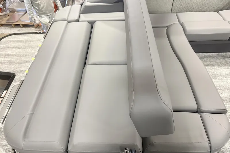 Slide: The Image of 2026 Bennington 22 M Swingback boat interior with sleek gray seating design. - 11