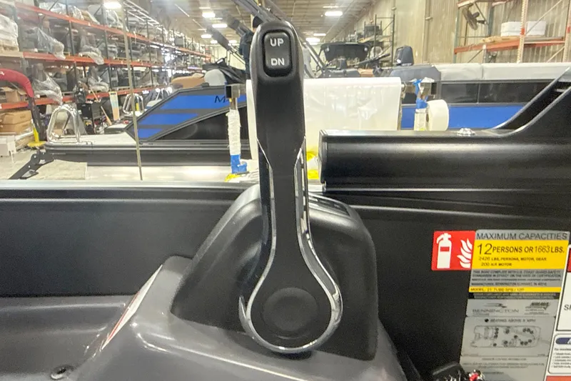 Slide: The Image of Throttle control of 2026 Bennington 22 M Swingback boat in a warehouse setting. - 15